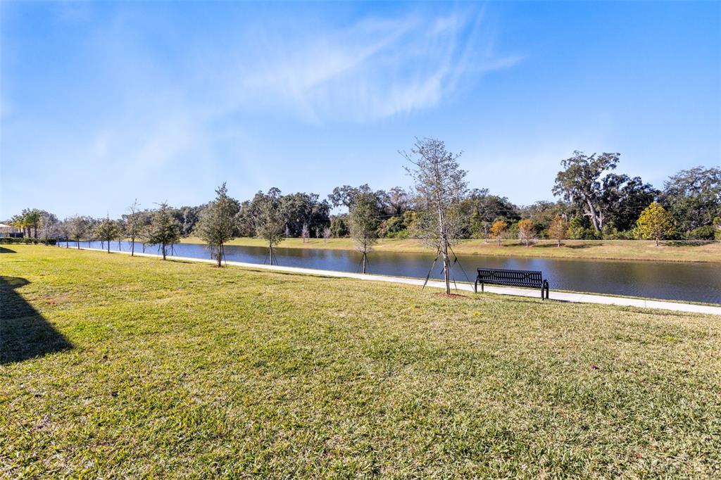 4394 Campsite Loop Orlando, FL 32824 - Photo 33 of 40 a view of a lake with houses in the background