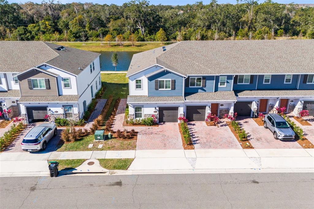4394 Campsite Loop Orlando, FL 32824 - Photo 34 of 40 an aerial view of a house with a garden and plants