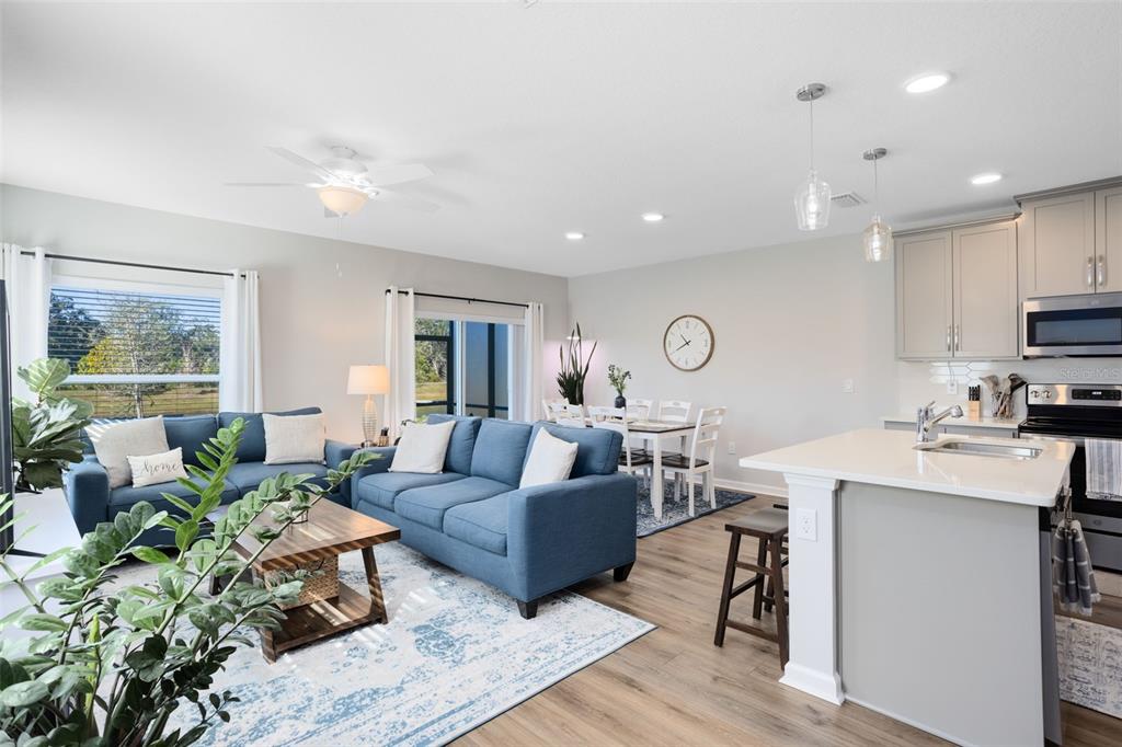 4394 Campsite Loop Orlando, FL 32824 - Photo 4 of 40 a living room with furniture kitchen view and a window