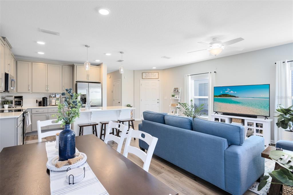 4394 Campsite Loop Orlando, FL 32824 - Photo 8 of 40 a living room with furniture and a flat screen tv