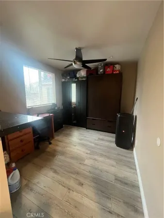 a kitchen with granite countertop a refrigerator a sink a stove and cabinets