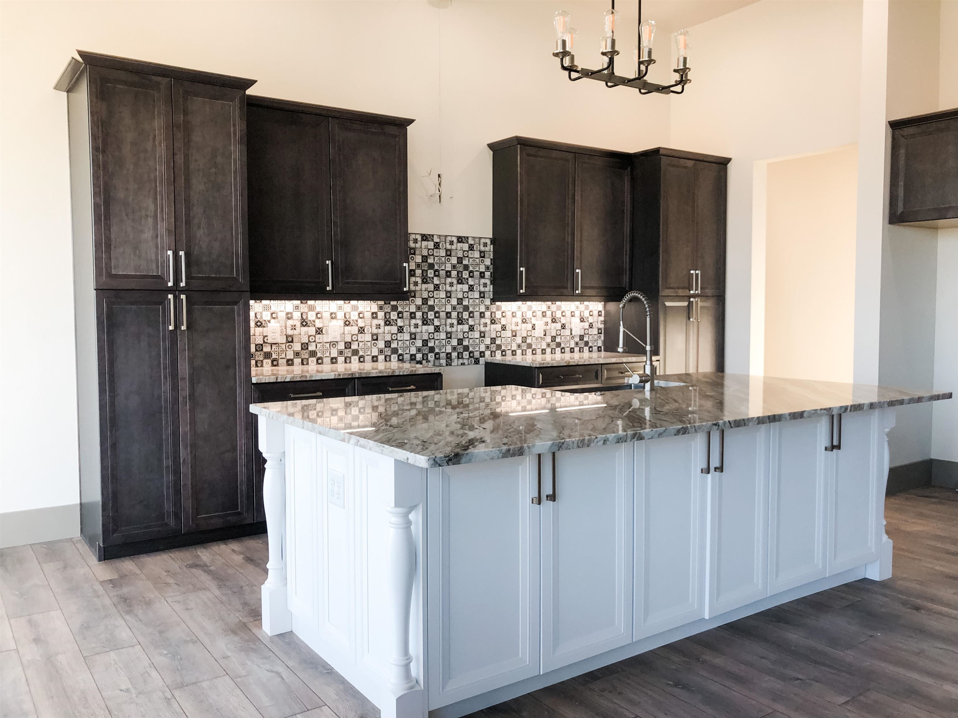 1697 P Road Loma, CO 81524 - Photo 3 of 39 a kitchen with granite countertop a refrigerator and a stove