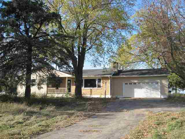 1860 West Becker School Road Freeport, IL 61032 - Photo 1 of 12 a front view of a house with a yard and garage