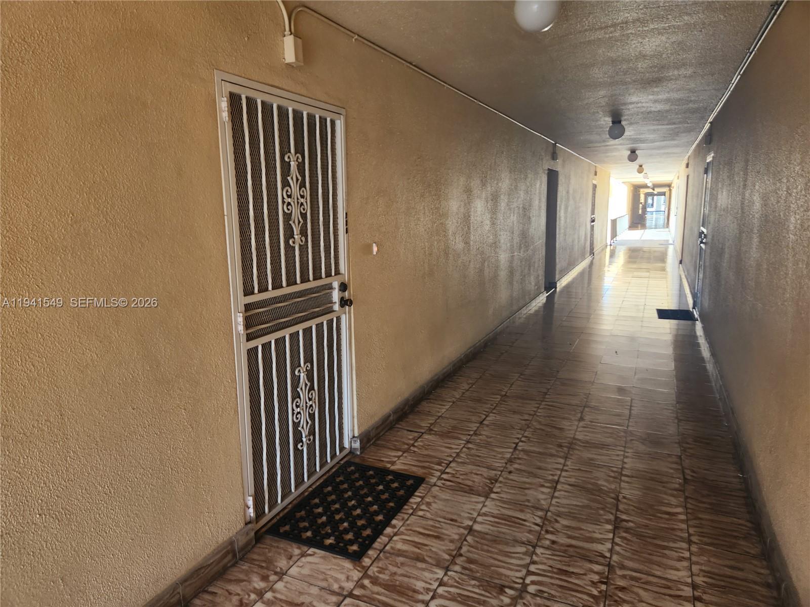 8990 Southwest 24th Street, Unit 228 Miami, FL 33165 - Photo 11 of 17 a view of a hallway