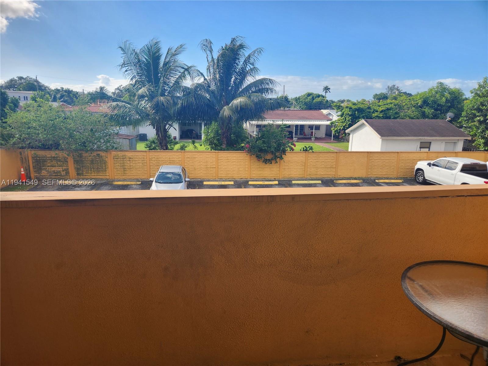 8990 Southwest 24th Street, Unit 228 Miami, FL 33165 - Photo 14 of 17 a view of lake with houses