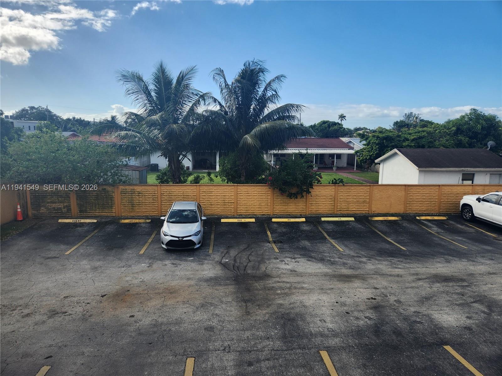 8990 Southwest 24th Street, Unit 228 Miami, FL 33165 - Photo 20 of 20 a view of backyard with outdoor seating and covered with trees