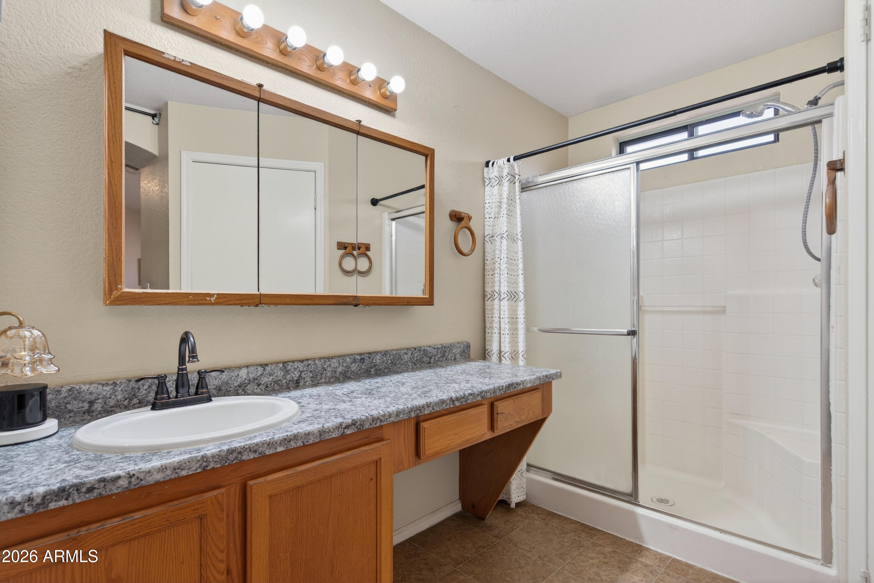 4547 North 87th Avenue Phoenix, AZ 85037 - Photo 13 of 22 a bathroom with a granite countertop sink mirror and double