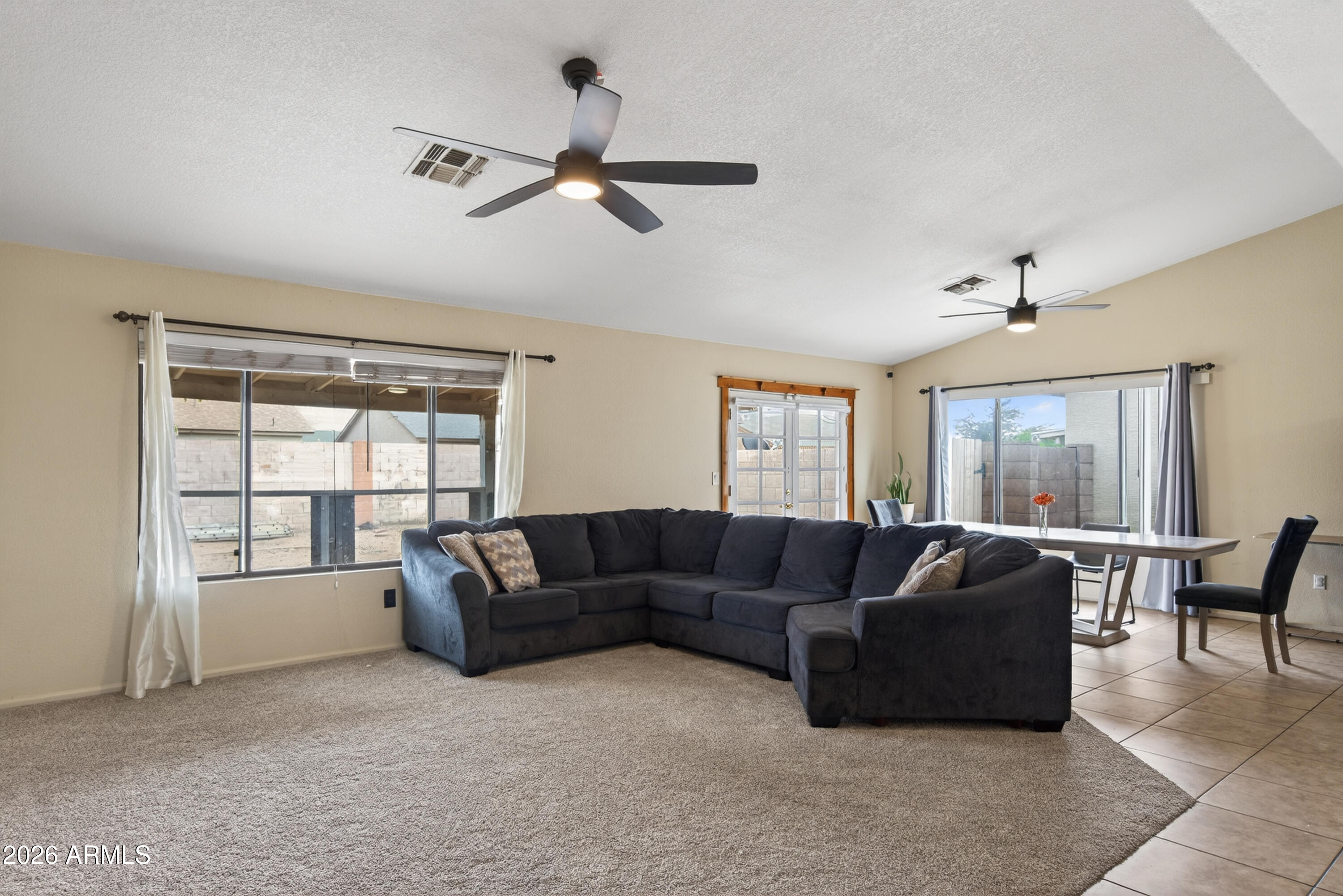 4547 North 87th Avenue Phoenix, AZ 85037 - Photo 2 of 22 a living room with furniture and a window
