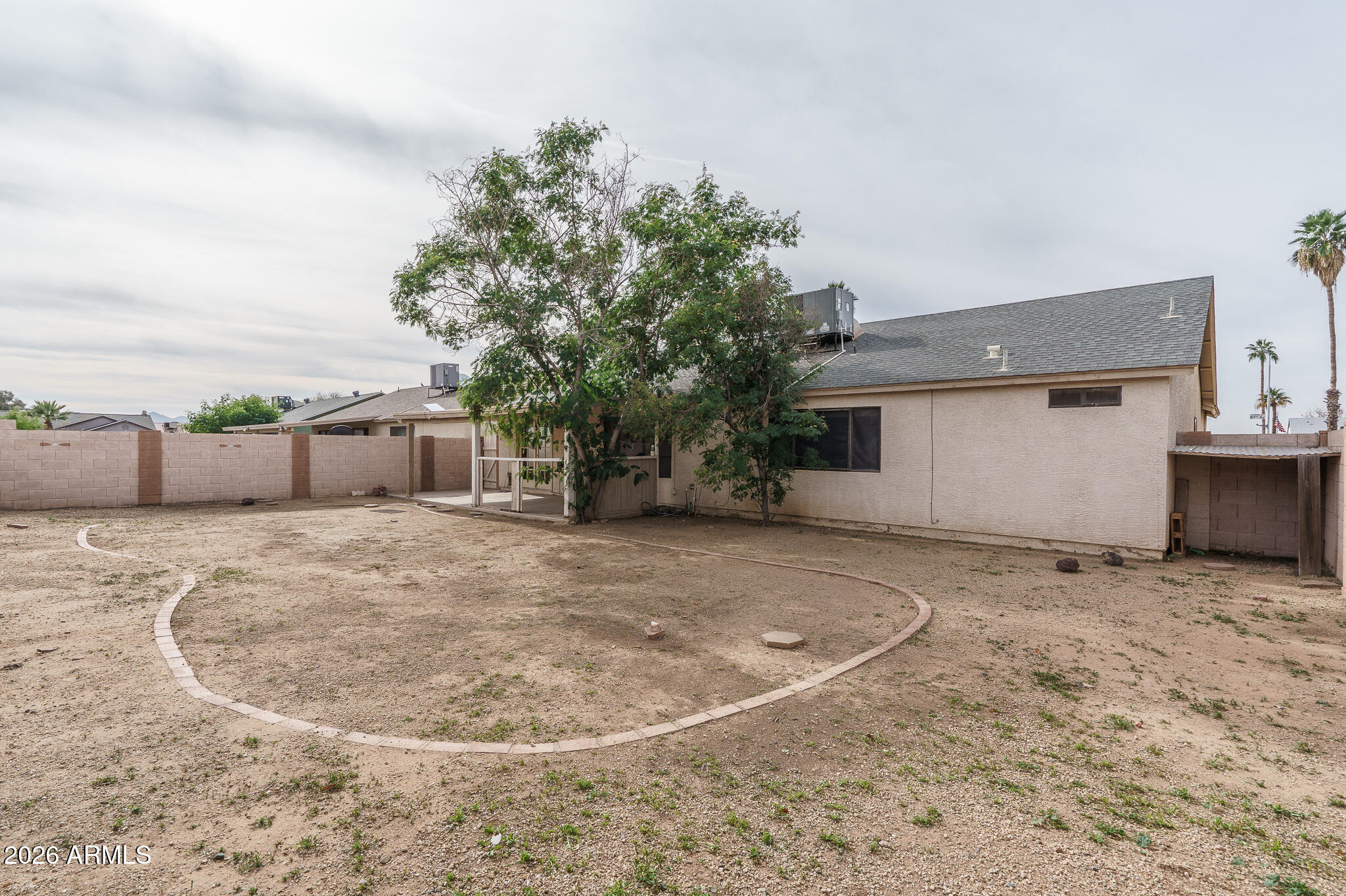 4547 North 87th Avenue Phoenix, AZ 85037 - Photo 21 of 22 a view of a house with a backyard
