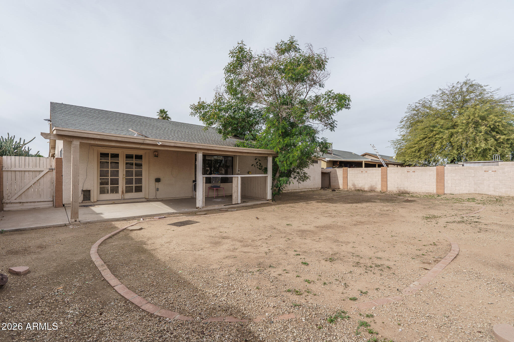 4547 North 87th Avenue Phoenix, AZ 85037 - Photo 22 of 22 front view of a house with a trees
