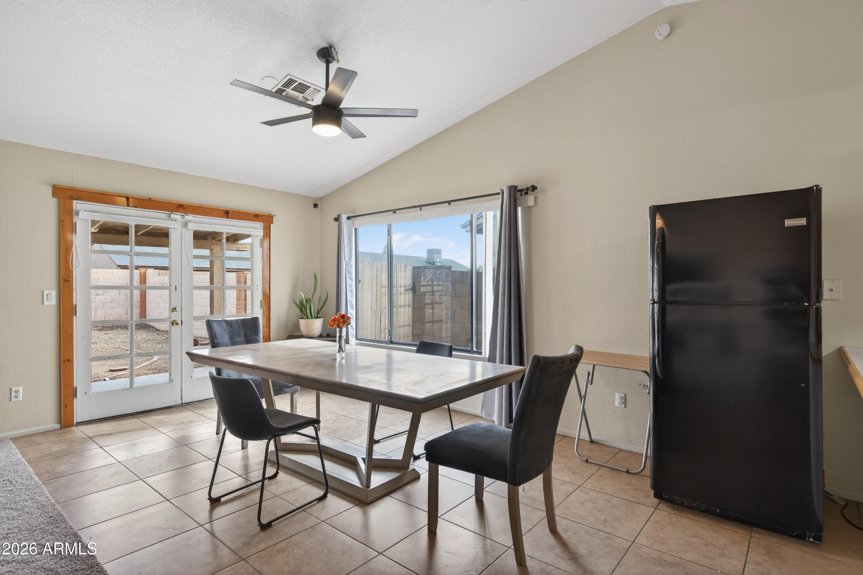 4547 North 87th Avenue Phoenix, AZ 85037 - Photo 9 of 22 a dining room with furniture and window