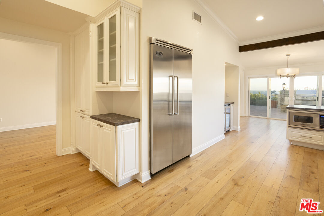 18436 Wakecrest Drive Malibu, CA 90265 - Photo 12 of 41 a view of a kitchen with wooden floor and a hallway