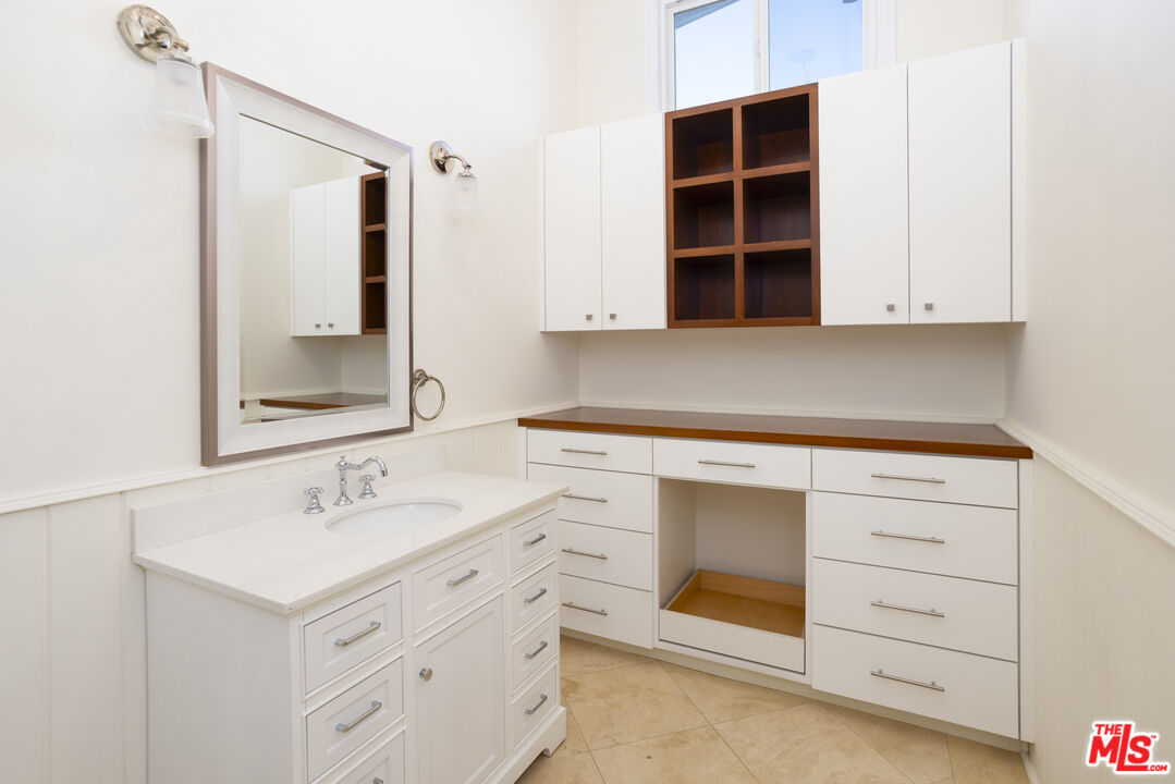 18436 Wakecrest Drive Malibu, CA 90265 - Photo 32 of 41 a bathroom with a sink and a mirror