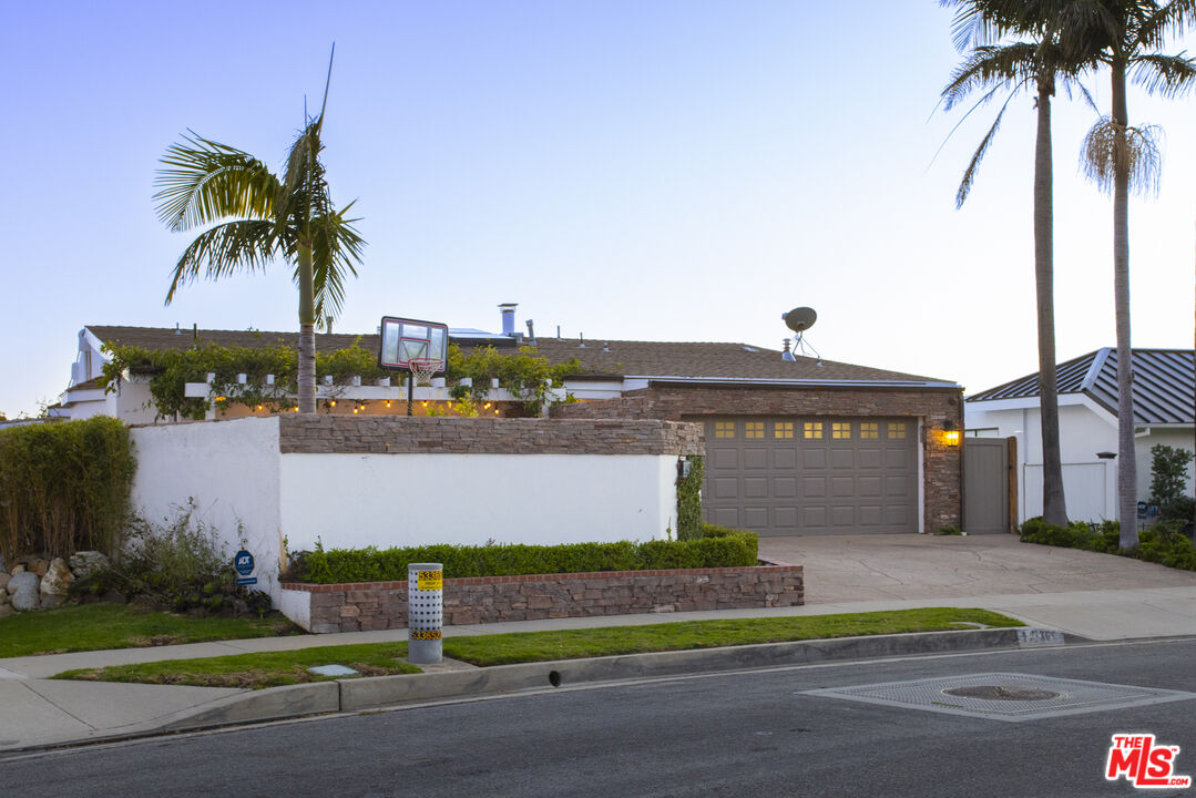 18436 Wakecrest Drive Malibu, CA 90265 - Photo 40 of 41 a front view of multiple houses with yard