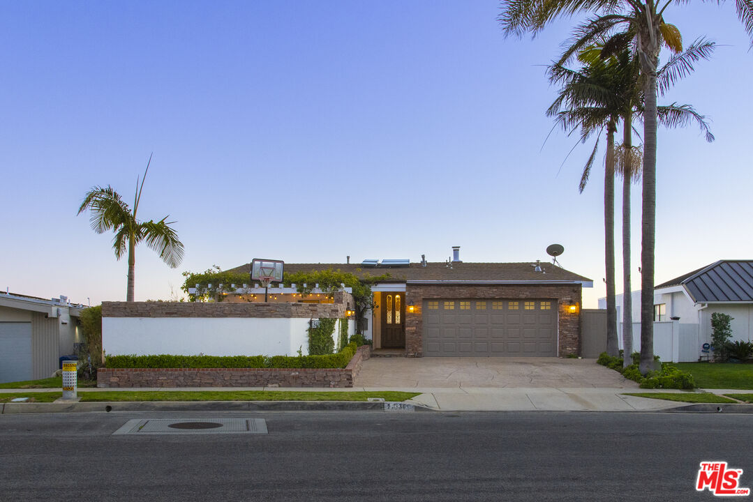 18436 Wakecrest Drive Malibu, CA 90265 - Photo 4 of 41 a view of a building and palm trees