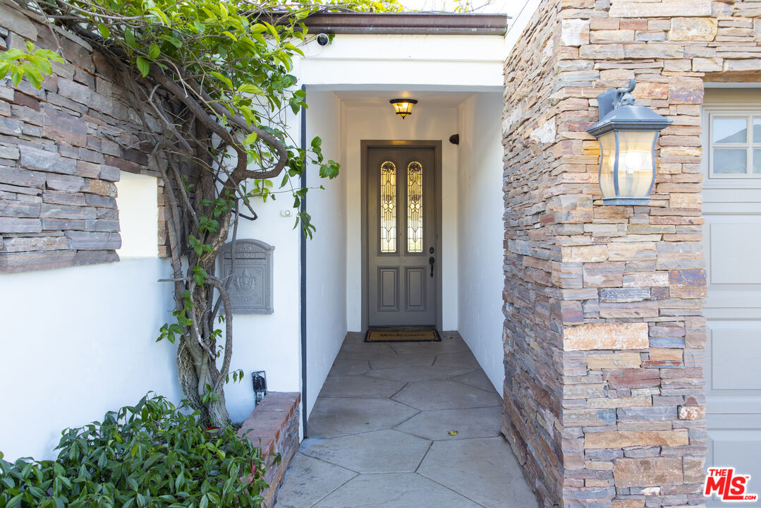 18436 Wakecrest Drive Malibu, CA 90265 - Photo 6 of 41 a view of entryway with a flower garden