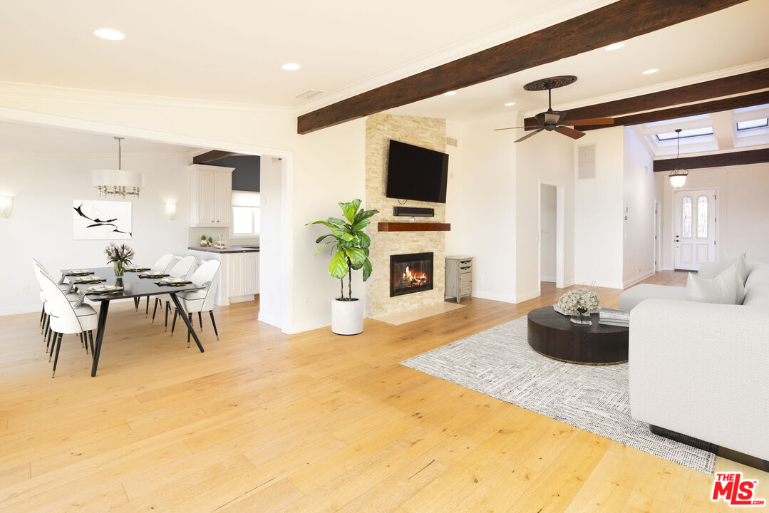 18436 Wakecrest Drive Malibu, CA 90265 - Photo 8 of 41 a living room with furniture and a flat screen tv