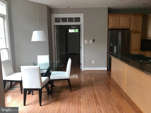 a view of a livingroom with furniture window and wooden floor