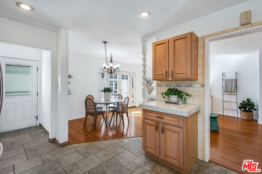2142 West 11th Street Santa Ana, CA 92703 - Photo 16 of 54 a view of a kitchen area with furniture and wooden floor