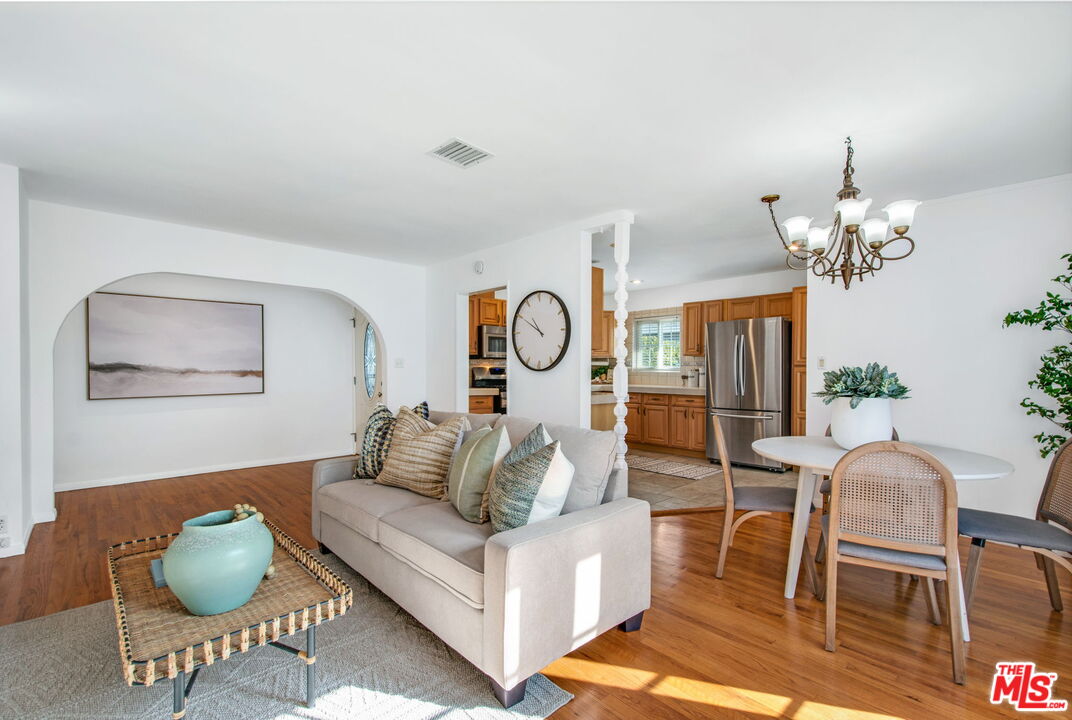 2142 West 11th Street Santa Ana, CA 92703 - Photo 18 of 54 a living room with furniture chandelier and a table
