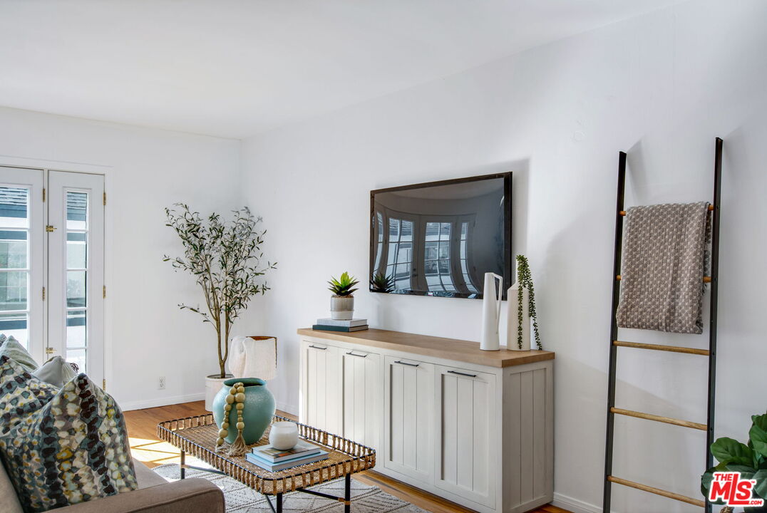 2142 West 11th Street Santa Ana, CA 92703 - Photo 20 of 54 a living room with furniture and a potted plant