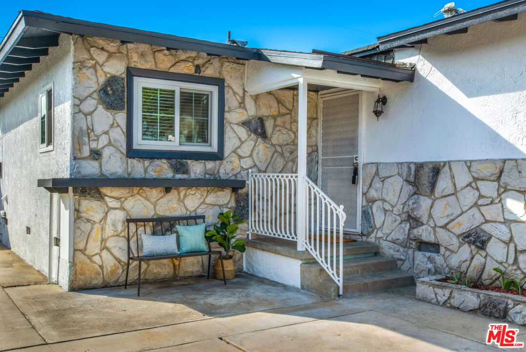 2142 West 11th Street Santa Ana, CA 92703 - Photo 2 of 54 a view of a chair and table in the patio