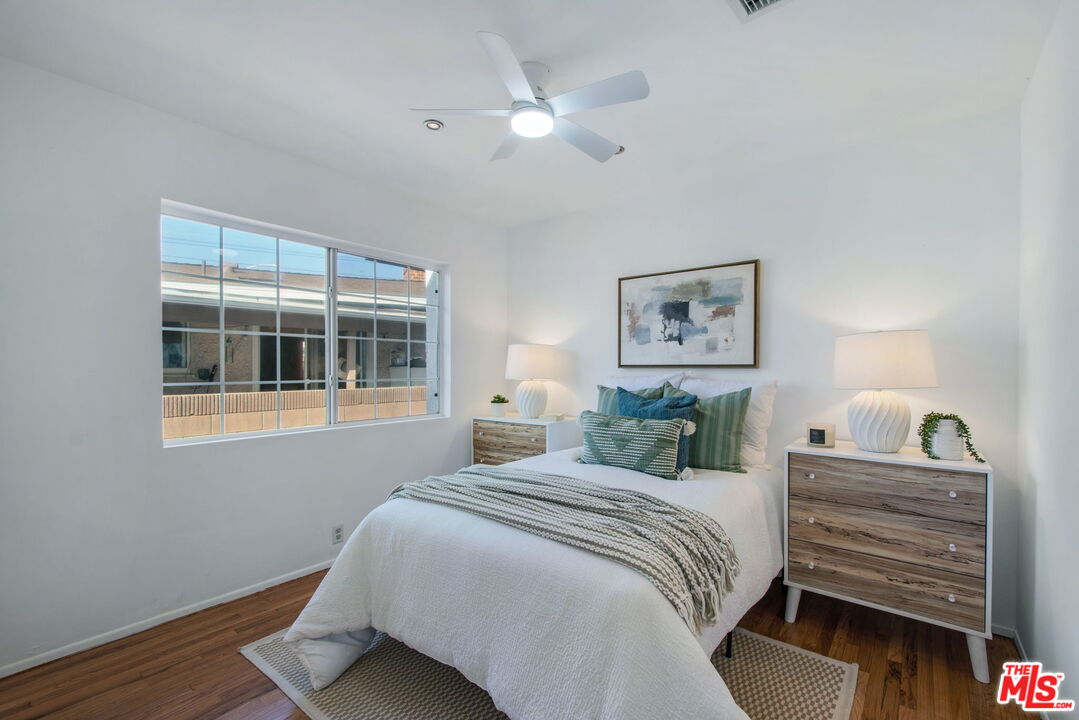 2142 West 11th Street Santa Ana, CA 92703 - Photo 27 of 54 a bedroom with a bed and a large window