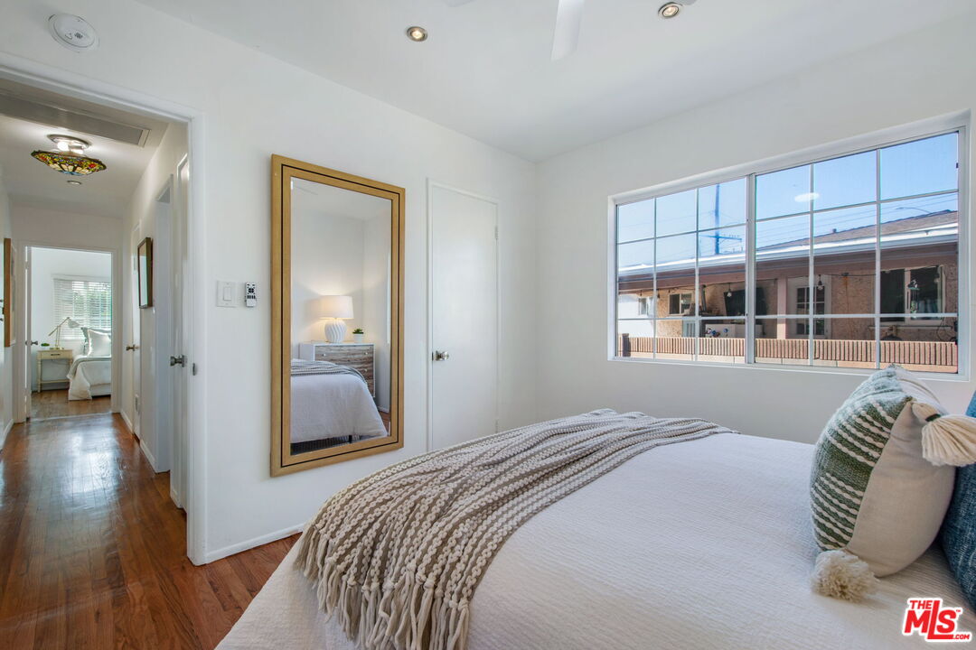 2142 West 11th Street Santa Ana, CA 92703 - Photo 28 of 54 a bedroom with a large bed and a large window