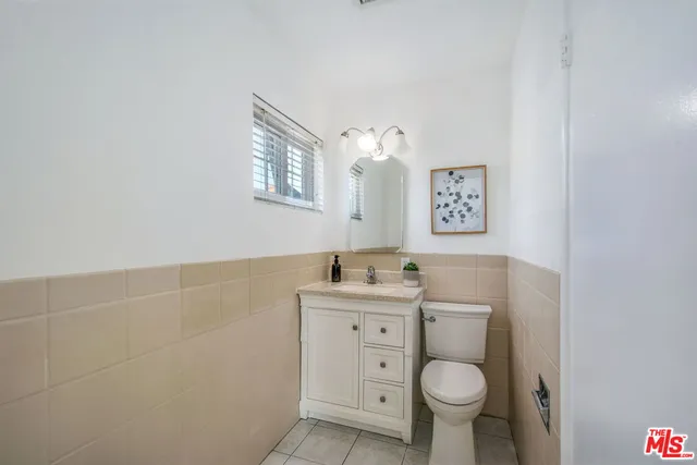 a kitchen with a table and chairs in it