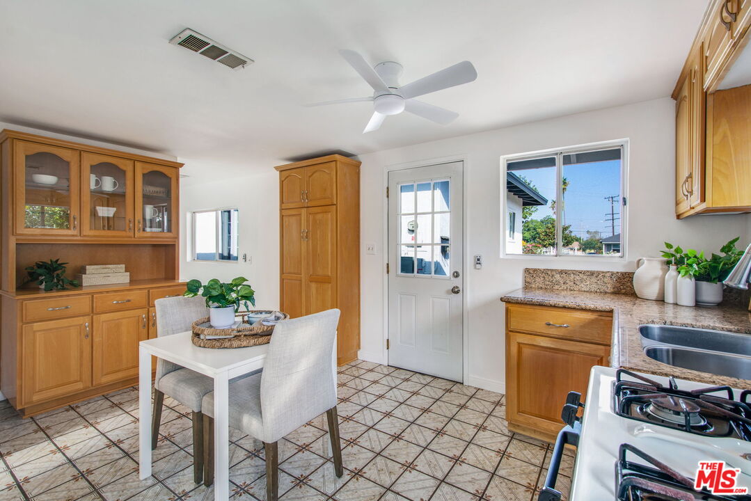 2142 West 11th Street Santa Ana, CA 92703 - Photo 35 of 54 a kitchen with a table and chairs in it