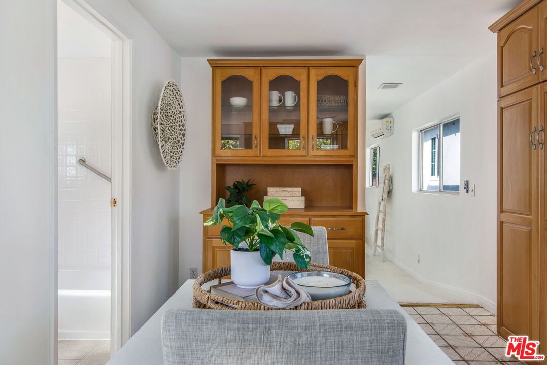 2142 West 11th Street Santa Ana, CA 92703 - Photo 36 of 54 a potted plant sitting on top of a wooden floor