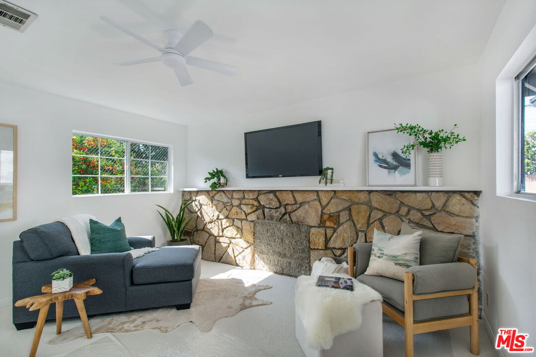 2142 West 11th Street Santa Ana, CA 92703 - Photo 38 of 54 a living room with furniture and a flat screen tv