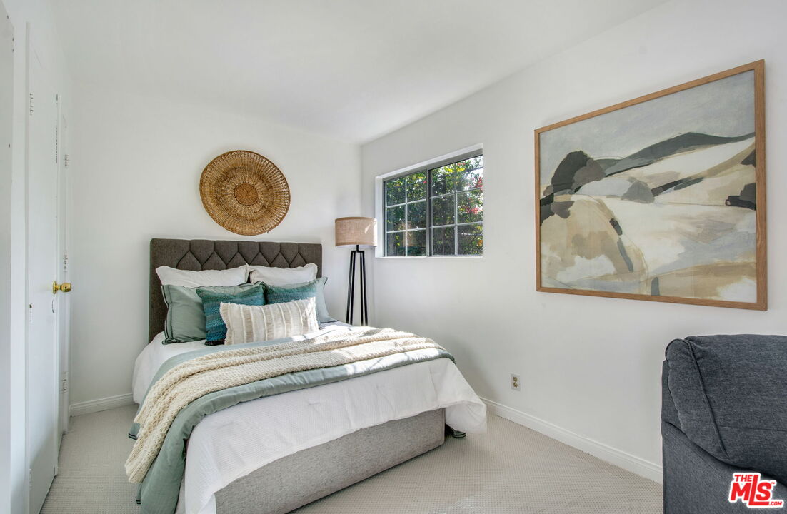 2142 West 11th Street Santa Ana, CA 92703 - Photo 39 of 54 a bedroom with a bed and a wall painting