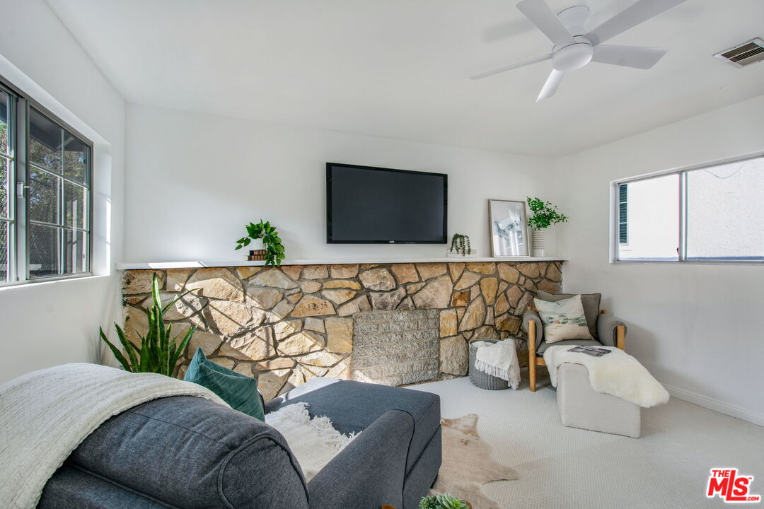 2142 West 11th Street Santa Ana, CA 92703 - Photo 41 of 54 a living room with furniture and a flat screen tv