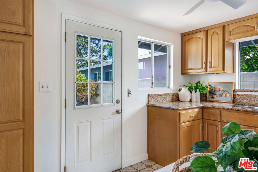 2142 West 11th Street Santa Ana, CA 92703 - Photo 44 of 54 a kitchen with a refrigerator and a sink