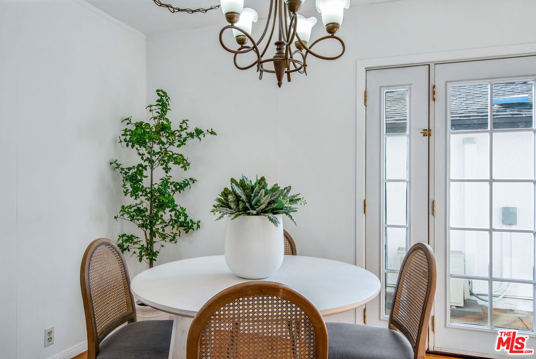 2142 West 11th Street Santa Ana, CA 92703 - Photo 6 of 54 a view of a dining room with furniture window and wooden floor