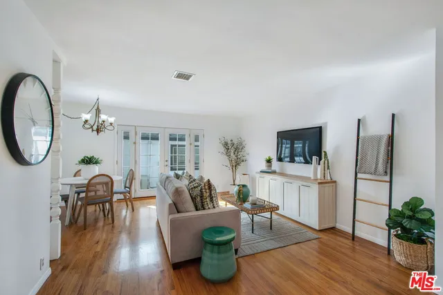 a kitchen with stainless steel appliances granite countertop a refrigerator sink and stove