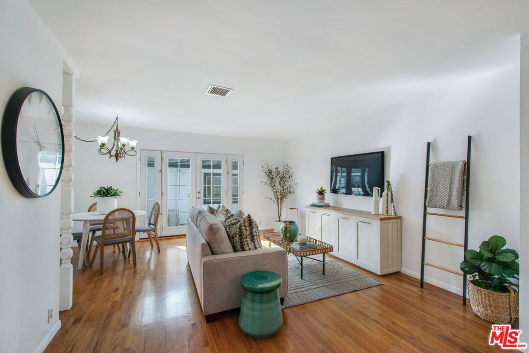 2142 West 11th Street Santa Ana, CA 92703 - Photo 8 of 54 a living room with furniture a flat screen tv and a large window