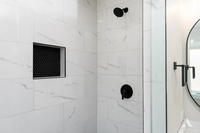 a bathroom with a shower and a window