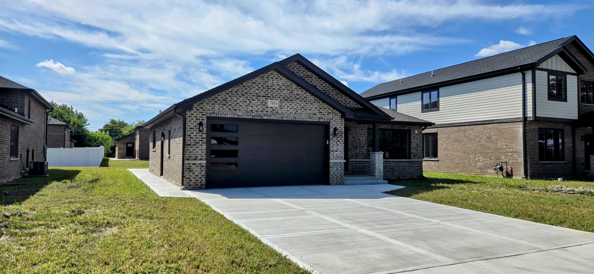 7951 West 73rd Place Bridgeview, IL 60455 - Photo 3 of 41 a front view of a house with a yard