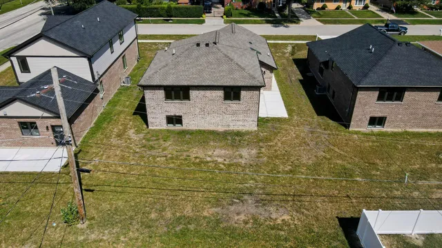 a aerial view of a house with a yard