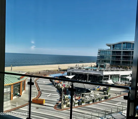 a view of a balcony with furniture and rug