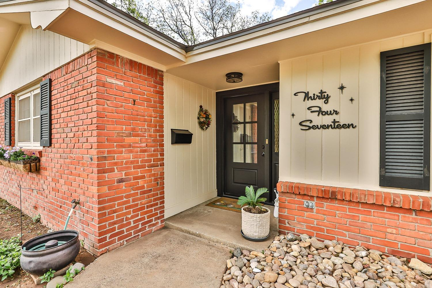 3417 61st Street Lubbock, TX 79413 - Photo 2 of 39 a view of a porch with potted plants