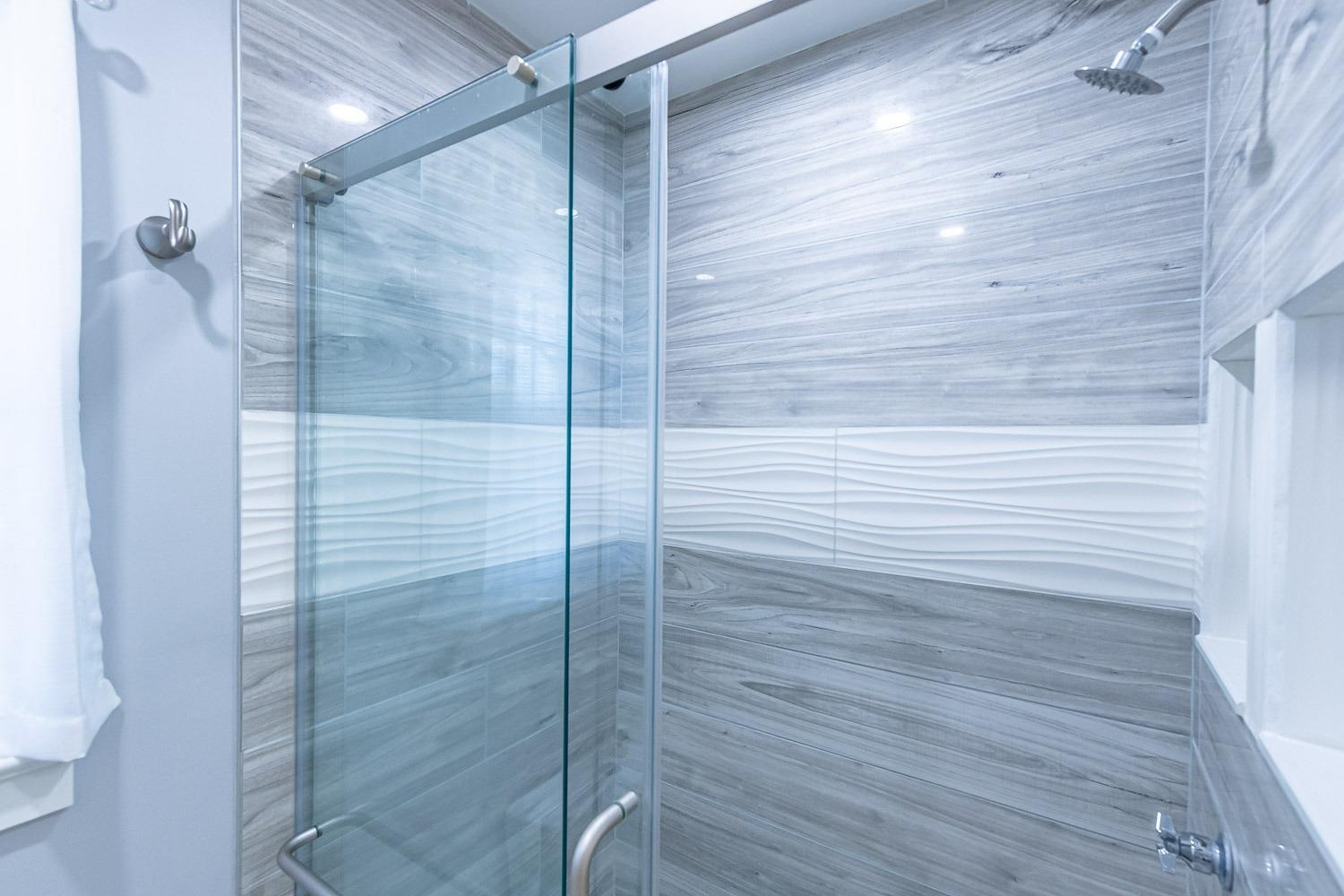 3417 61st Street Lubbock, TX 79413 - Photo 23 of 39 a bathroom with a shower