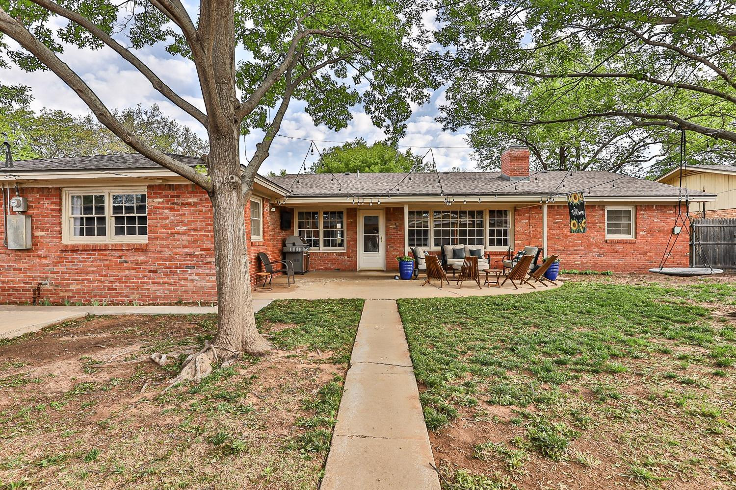 3417 61st Street Lubbock, TX 79413 - Photo 36 of 39 front view of a house with a yard