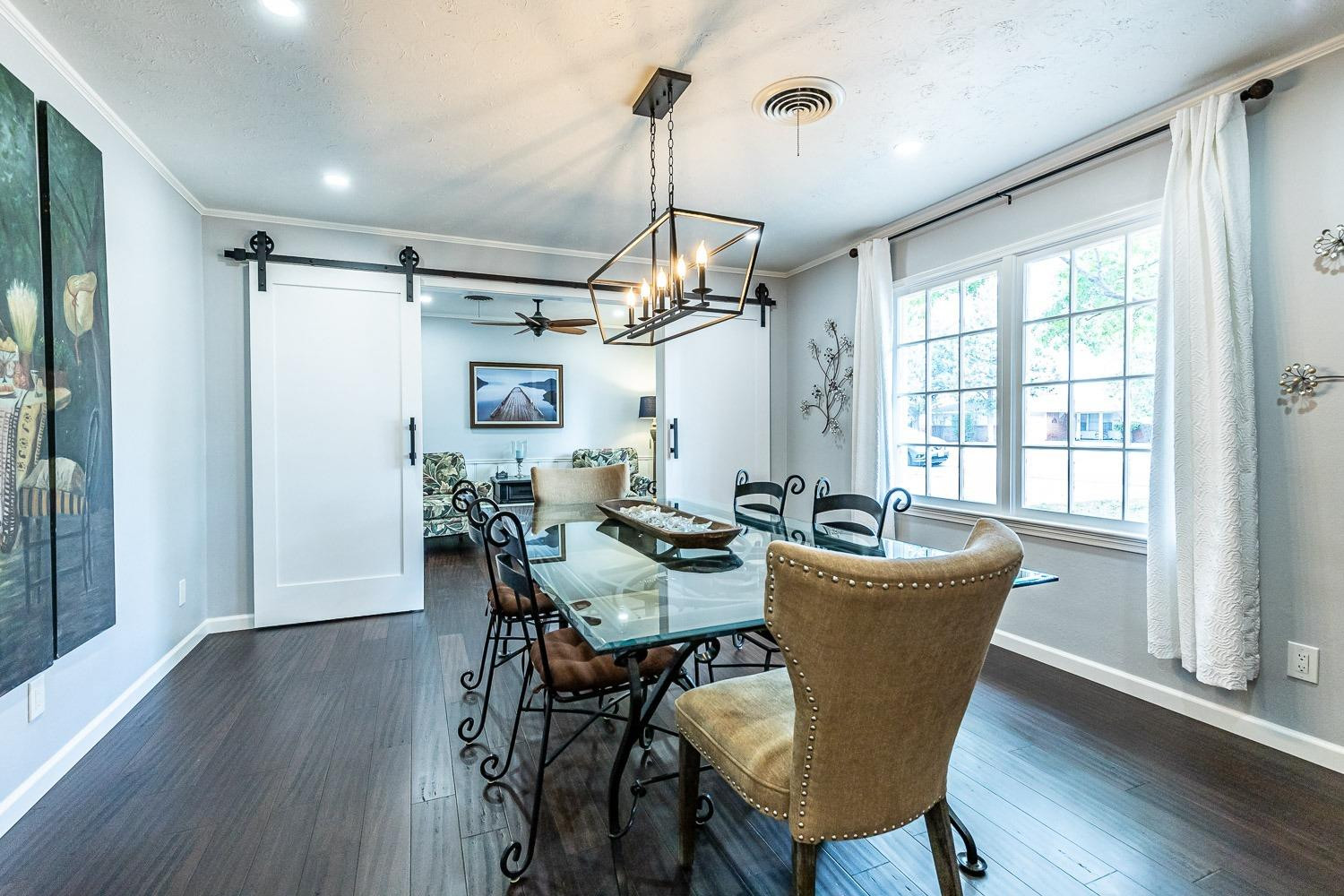 3417 61st Street Lubbock, TX 79413 - Photo 5 of 39 a view of a dining room with furniture window and wooden floor