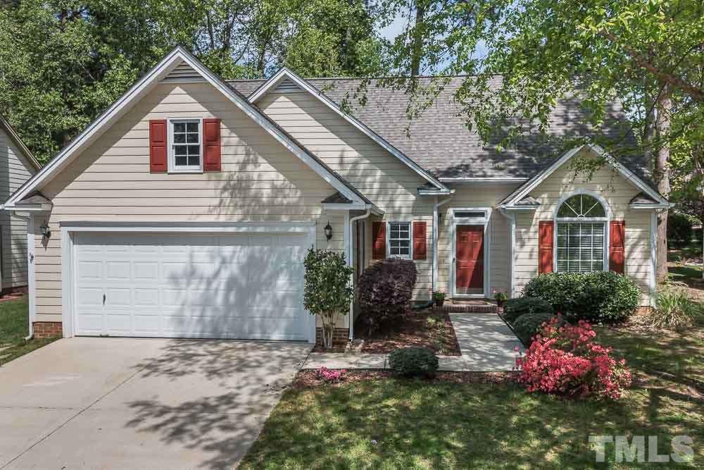 12404 Harcourt Drive Raleigh, NC 27613 - Photo 1 of 22 a front view of a house with a yard