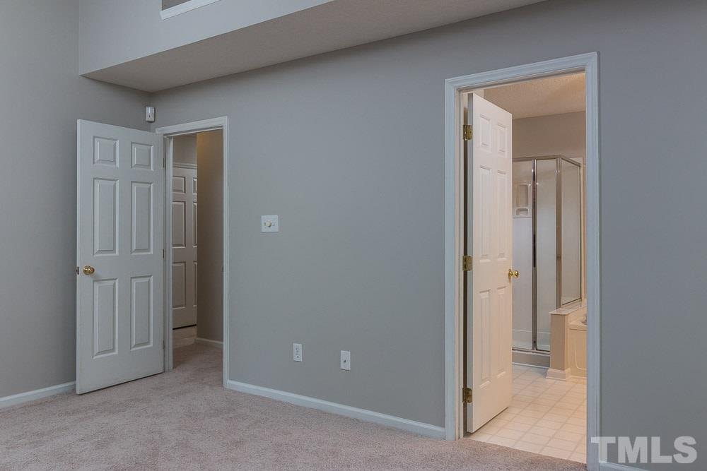 12404 Harcourt Drive Raleigh, NC 27613 - Photo 12 of 22 a view of an empty room with closet and a mirror