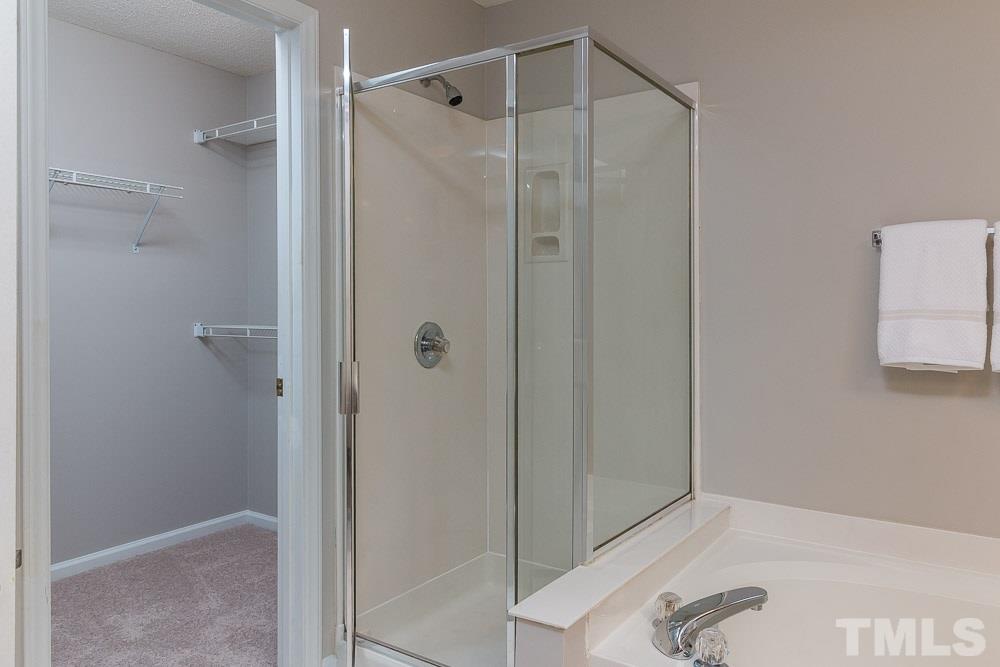 12404 Harcourt Drive Raleigh, NC 27613 - Photo 13 of 22 a bathroom with a shower and a sink