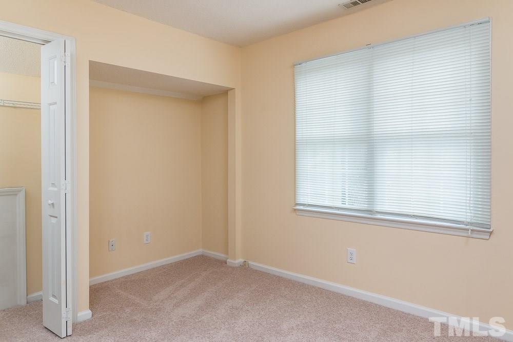 12404 Harcourt Drive Raleigh, NC 27613 - Photo 16 of 22 an empty room with a window